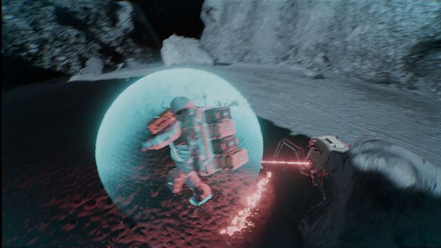 The player inside a shield bubble as a spider drone fires a red beam